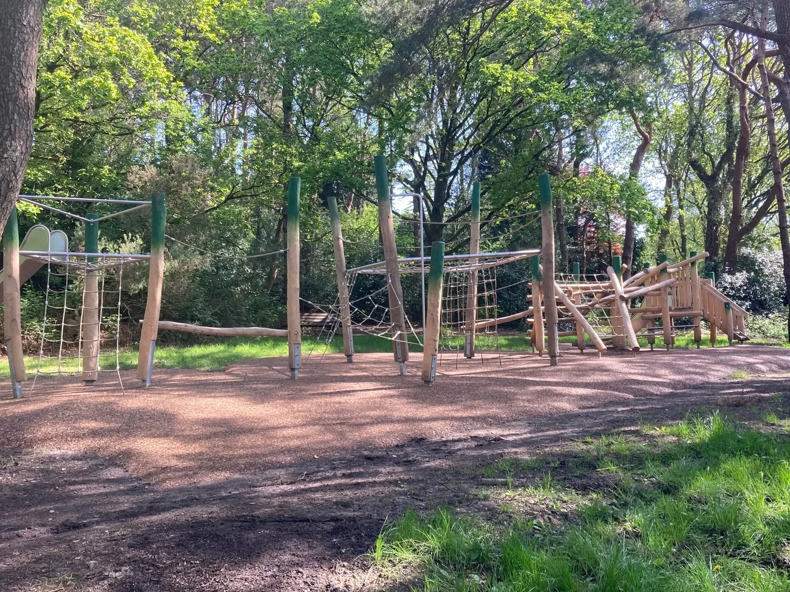 Timber climbing equipment in the play area at Broadstone Recreation Ground